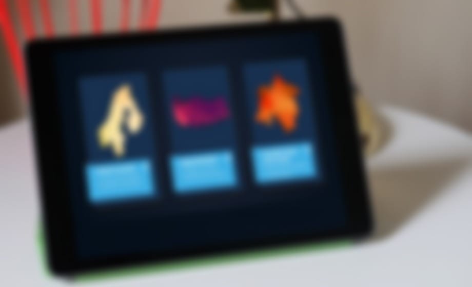 Tablet on a stand showing a touchscreen menu with three illustrated options
