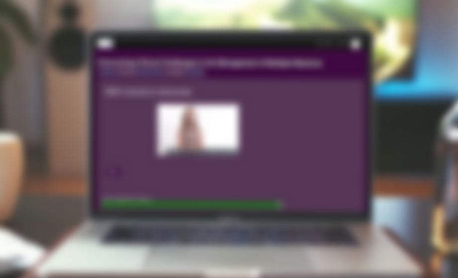 Laptop showing a course window opened over a learning site